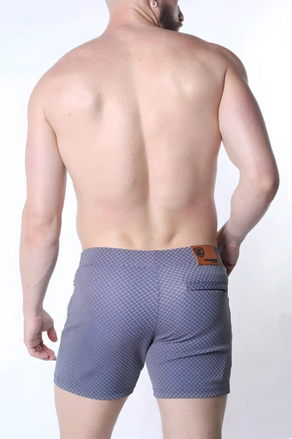 Clemente swim short limited edition blue patterned swim trunks with subtle geometric design and brown leather waistband patch