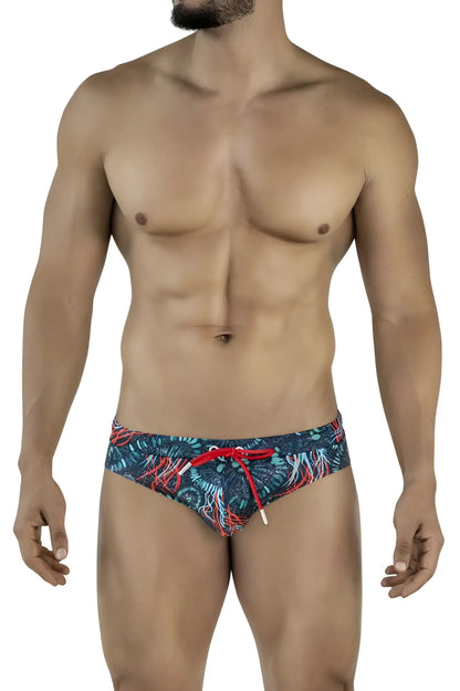 Men’s clever 2066 malpelo swim briefs in dark blue with vibrant red and teal tropical leaf patterns and bright red drawstrings