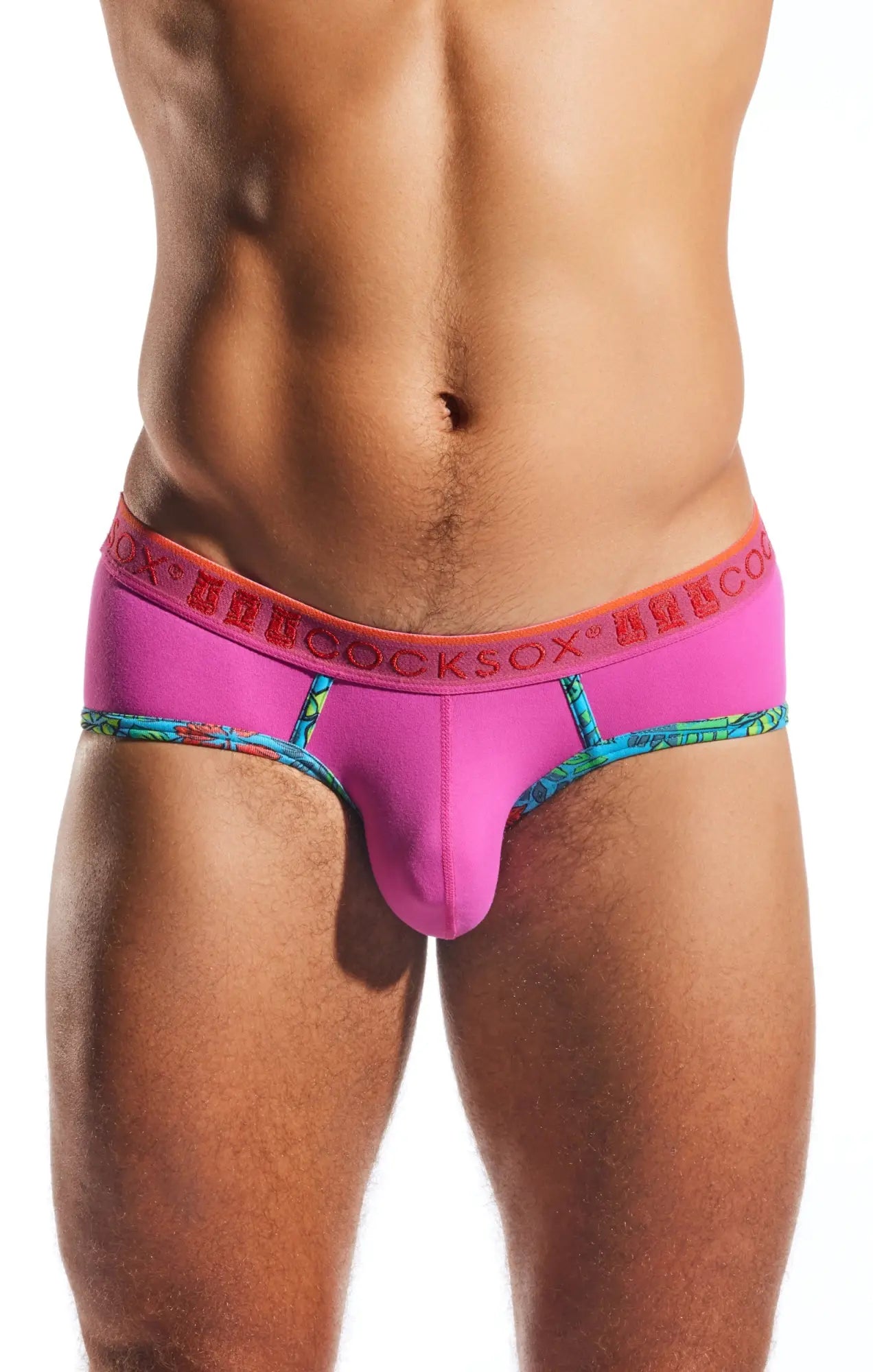 Bright pink Cocksox CX76N Supplex sports brief with bold orange ufocksox waistband and colorful patterned trim