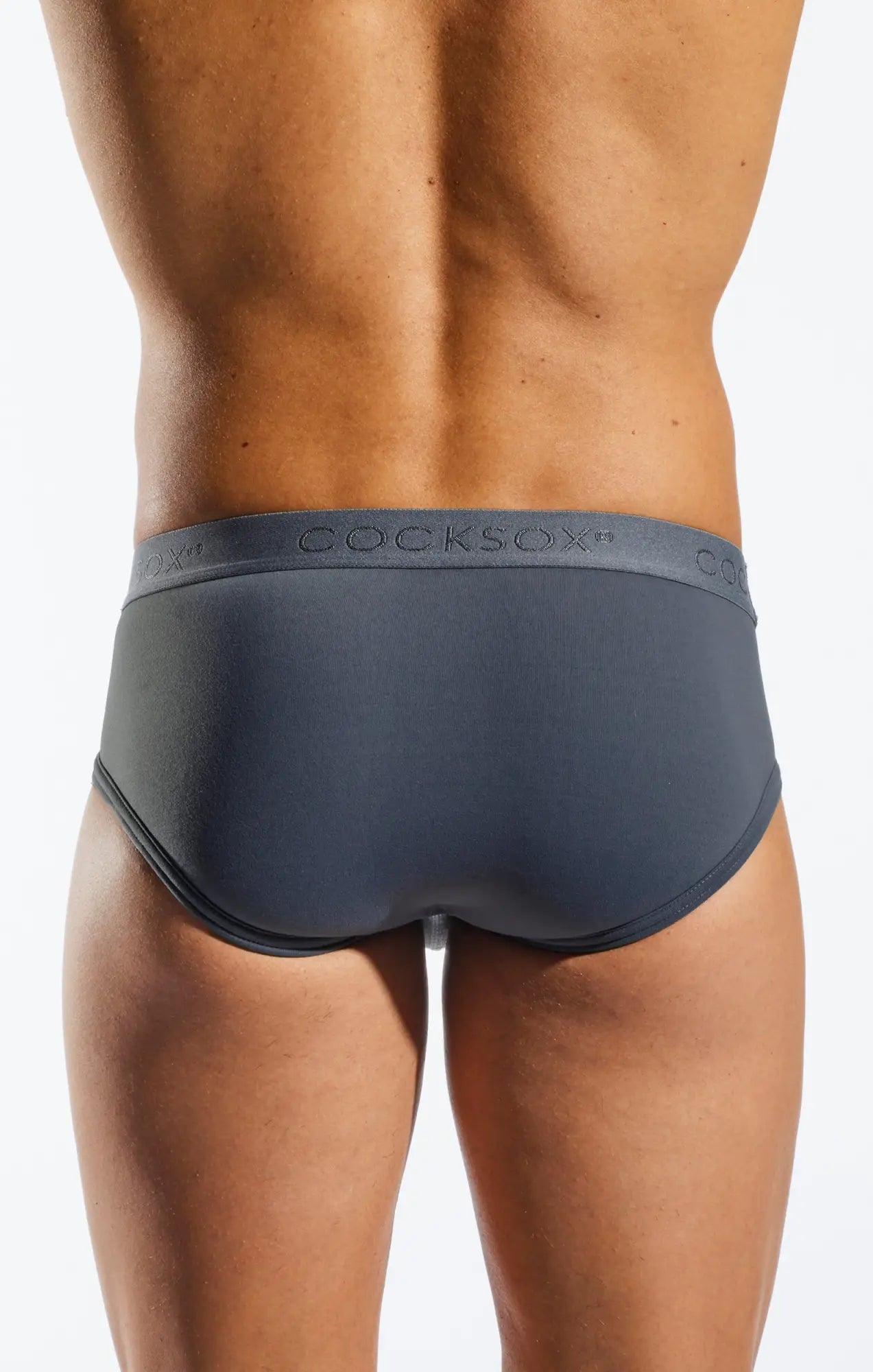 Dark gray cocksox cx76n supplex sports briefs with smooth form-fitting fabric and subtle waistband logo