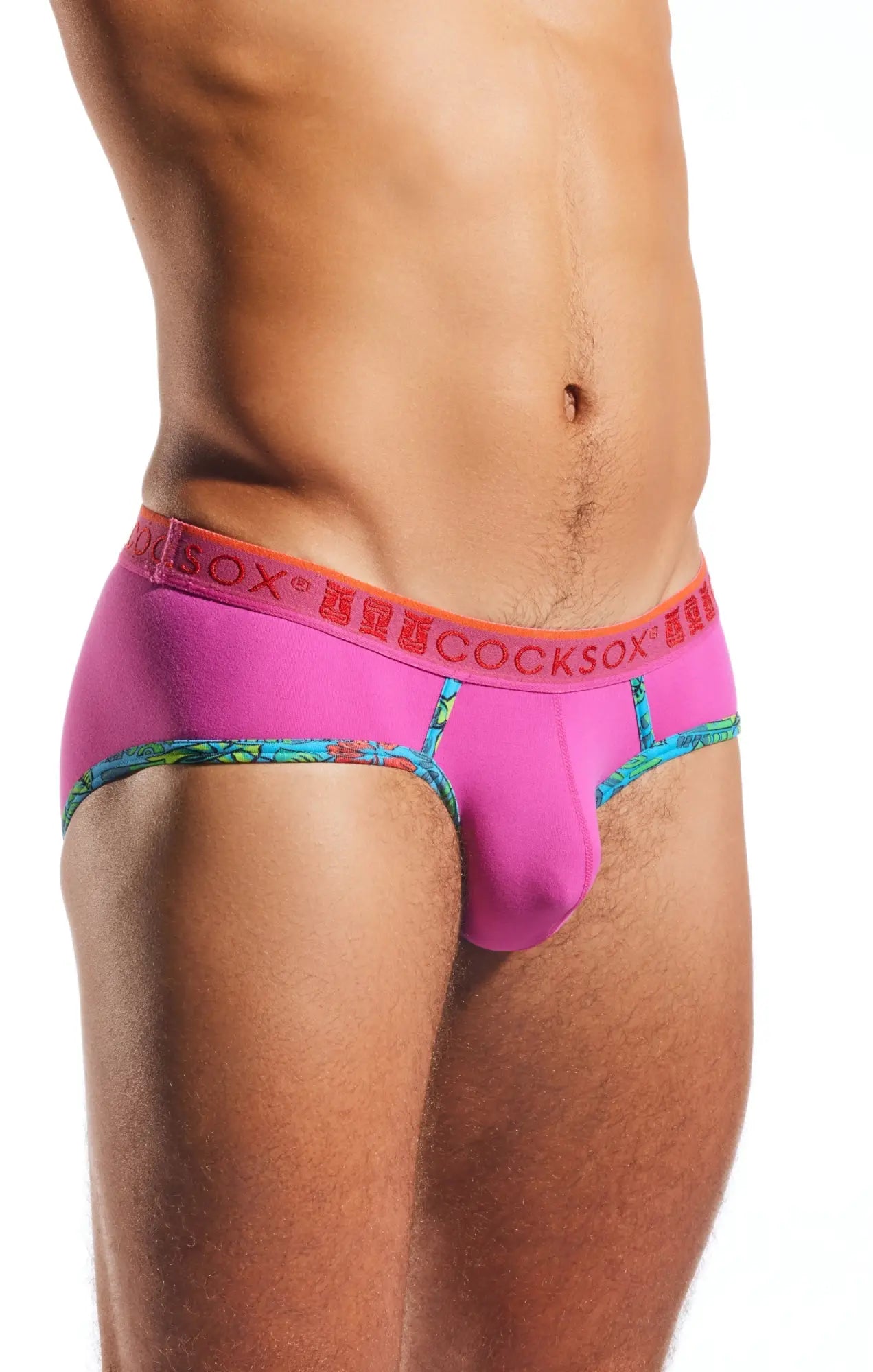 Vibrant pink cocksox cx76n supplex sports brief with bold orange waistband and colorful patterned trim