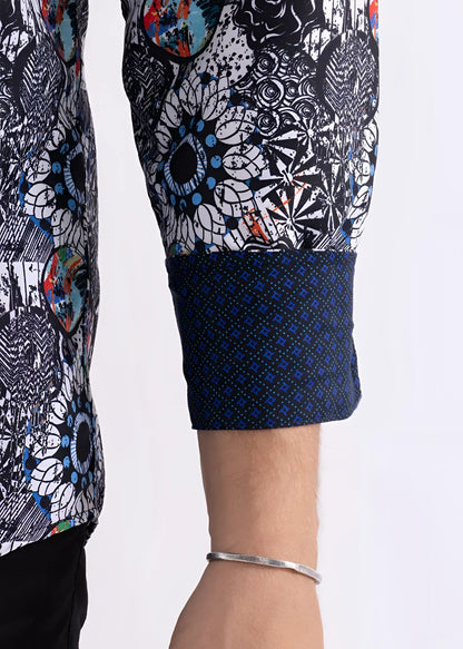 Colored shapes print l/s shirt sleeve with bold black white pattern and blue orange splashes and navy cuff with geometric design