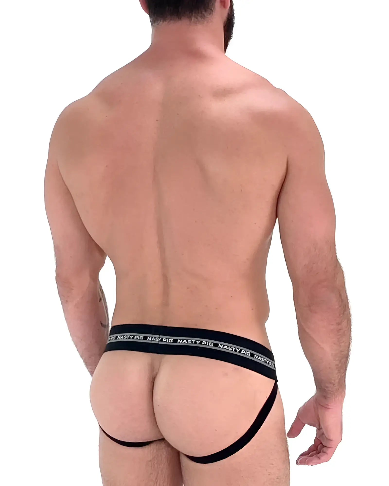 Black nasty pig core jockstrap briefs with wide elastic waistband and thin leg straps showing the back side