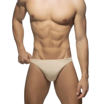 Beige cotton thong athletic briefs with sleek minimalist design for comfortable everyday wear
