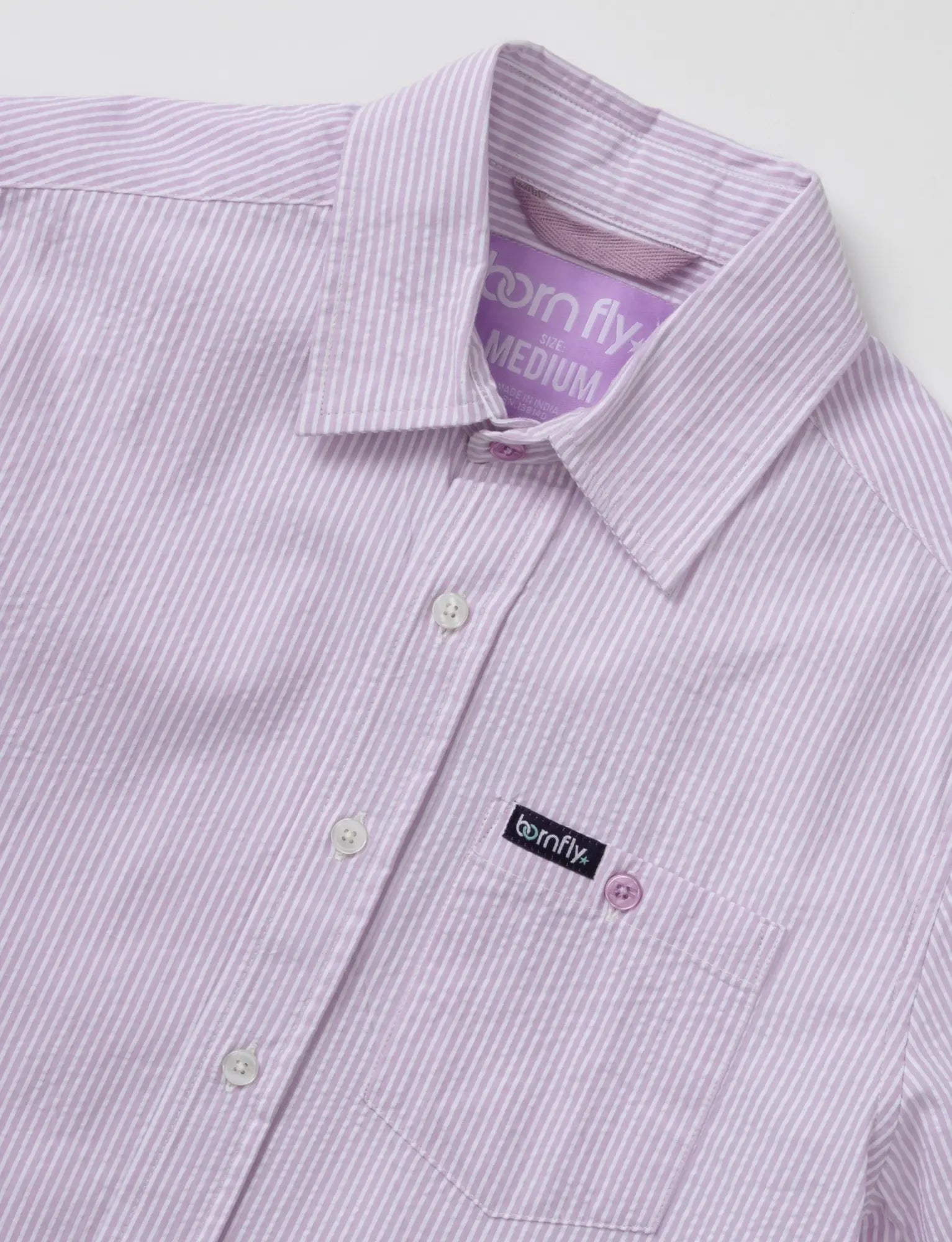 Country club fly seersucker shirt with lavender and white stripes textured fabric and born fly brand label on collar and pocket