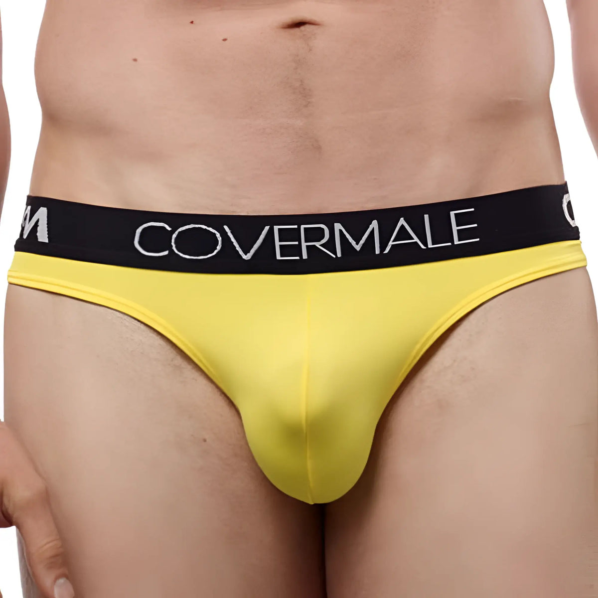 Bright yellow cover male cm115 bikini brief with black waistband and white brand lettering in form-fitting design