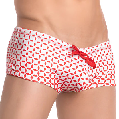 White swim trunks with red geometric leaf pattern and red drawstring from cover male cmh008 swimwear collection