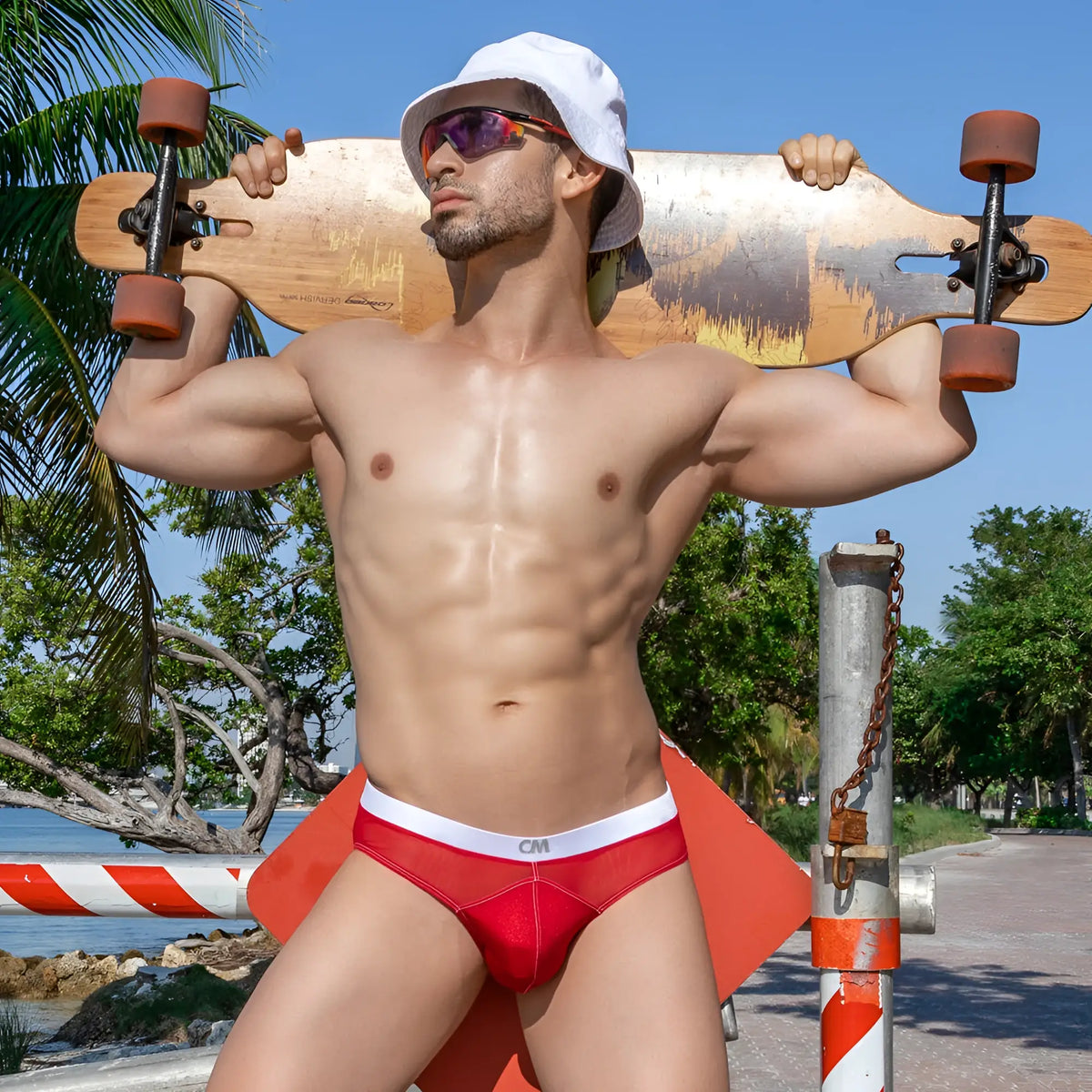 Red cm menâ€™s briefs with white waistband showing half-naked back bikini style by Cover Male CMI062