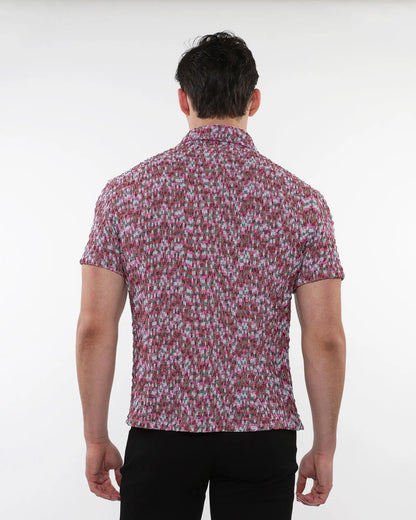A man wearing a crinkle knit short sleeve shirt in pink gray and white marled texture visible from the front