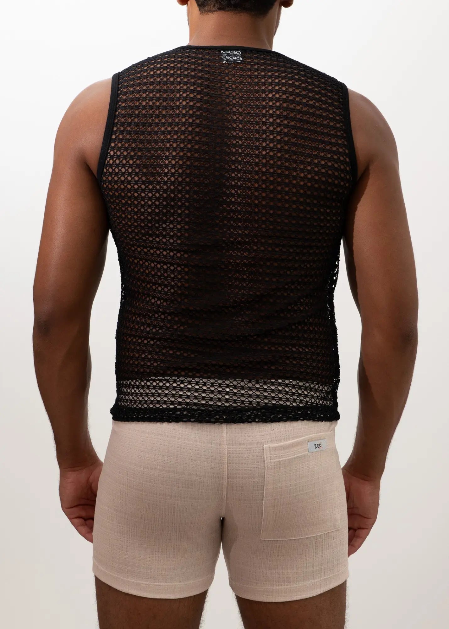 Black crochet muscle tank top with breathable black mesh fabric and fitted design for active wear
