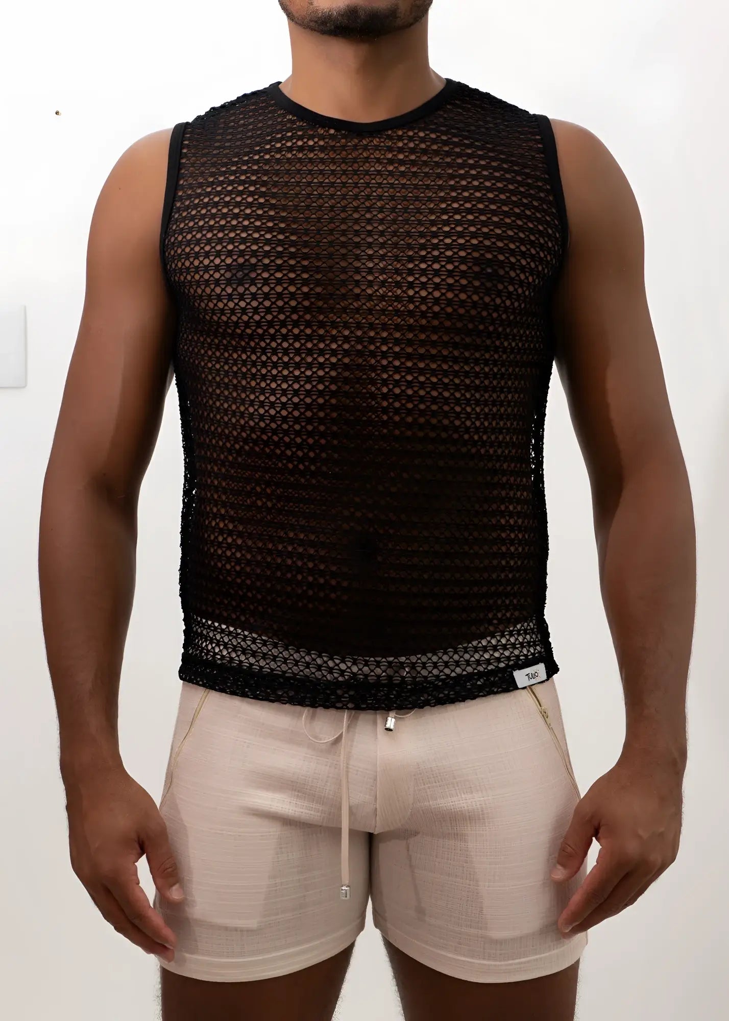 Black mesh crochet muscle tank top with sleeveless design, round neckline, and elasticated hem