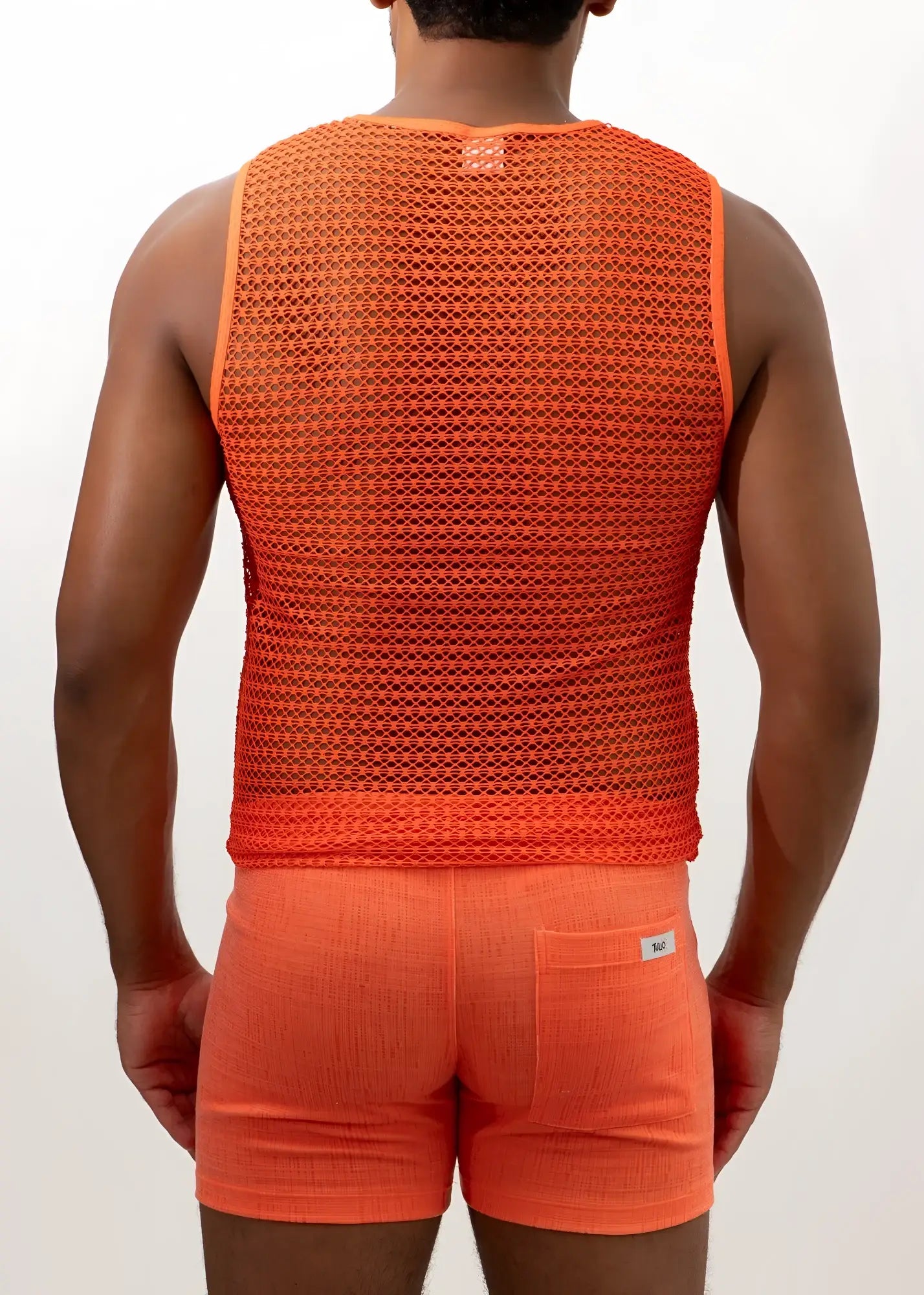 Orange crochet muscle tank top with textured breathable mesh fabric and small brand tag at the neckline