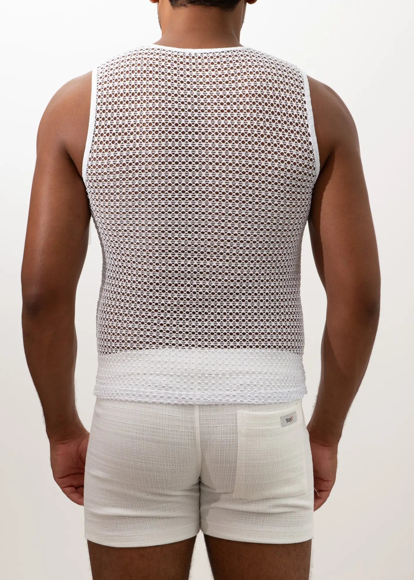 White crochet mesh muscle tank top with a solid white band at the bottom for casual summer wear