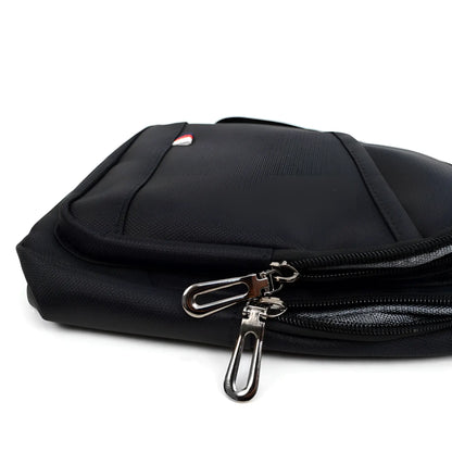 Black nylon crossbody sling bag with silver zipper pulls and small red white and blue logo on the front