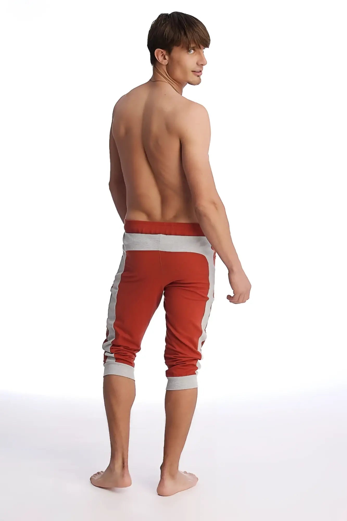 Cuffed yoga pants in cinnabar and grey with ribbed cuffs designed for comfortable athletic wear