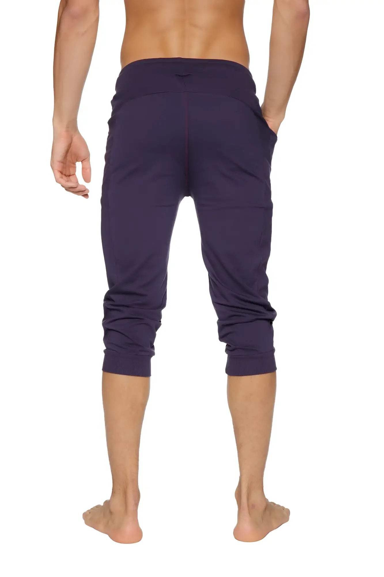 Dark purple cuffed yoga pants with stretchy fabric and elastic waistband for comfortable activewear use