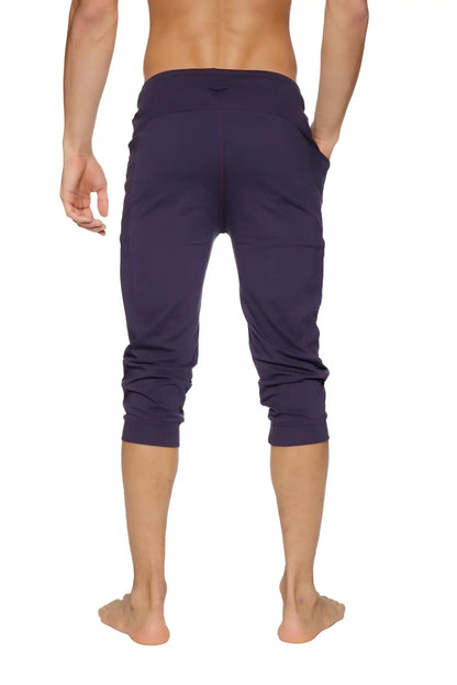 Dark purple cuffed yoga pants with stretchy fabric and elastic waistband for comfortable activewear use