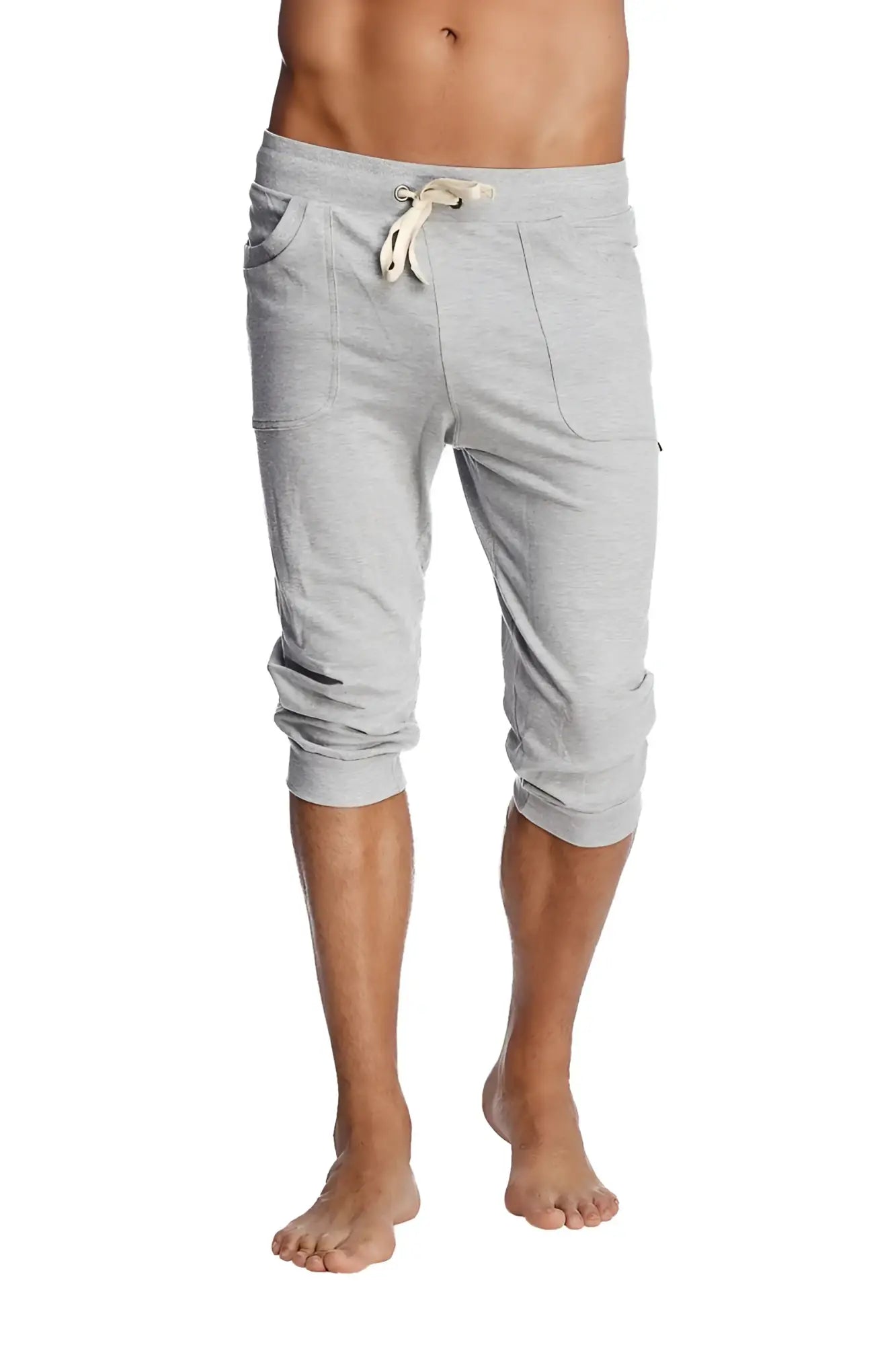 Cuffed yoga pants in solid heather grey with a drawstring waistband and side pockets made from soft fabric