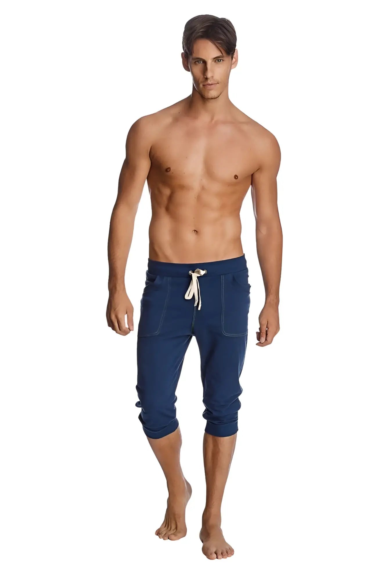 Navy blue cuffed yoga pants with white drawstring and side pockets designed as capri-length jogger pants