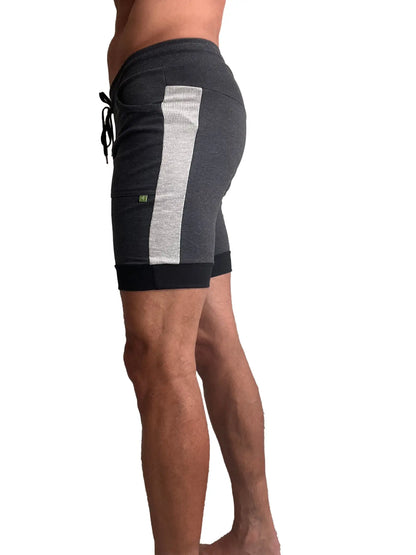 Dark gray cuffed yoga shorts with textured silver stripe and black drawstring waistband for athletic wear