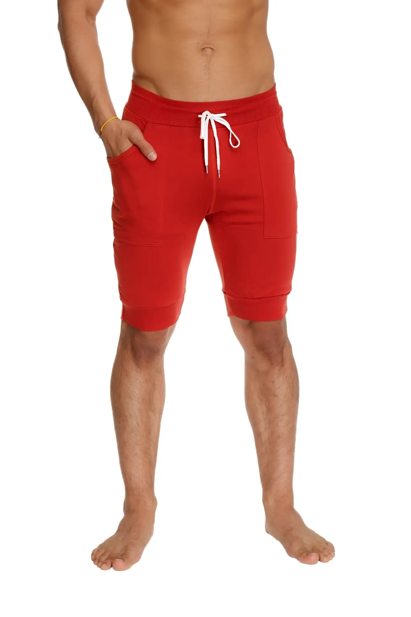 Cuffed yoga shorts in cinnabar red with white drawstring and side pockets designed for athletic wear