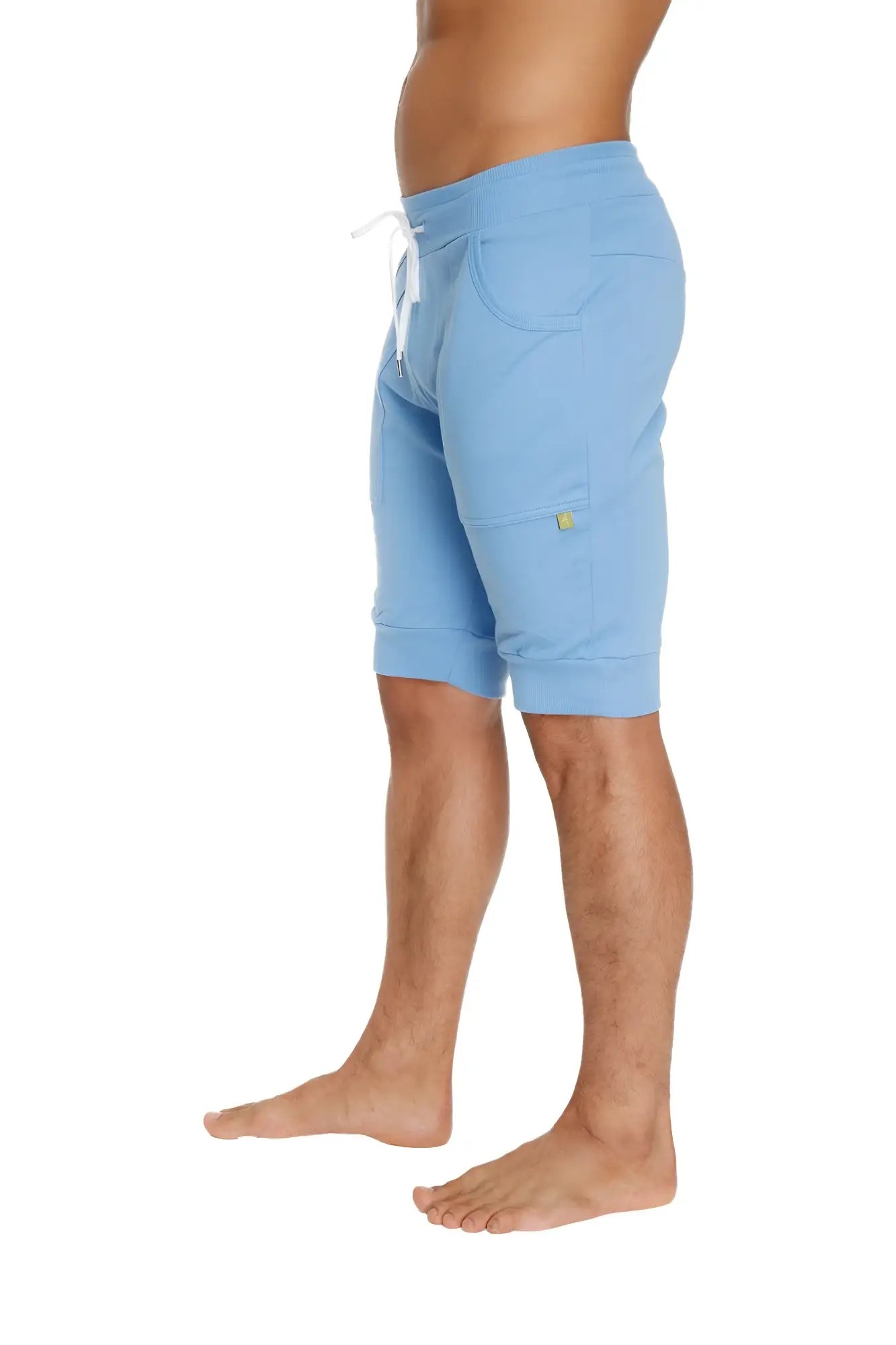 Cuffed yoga shorts in ice blue soft fabric with white drawstring and small yellow logo on side pocket