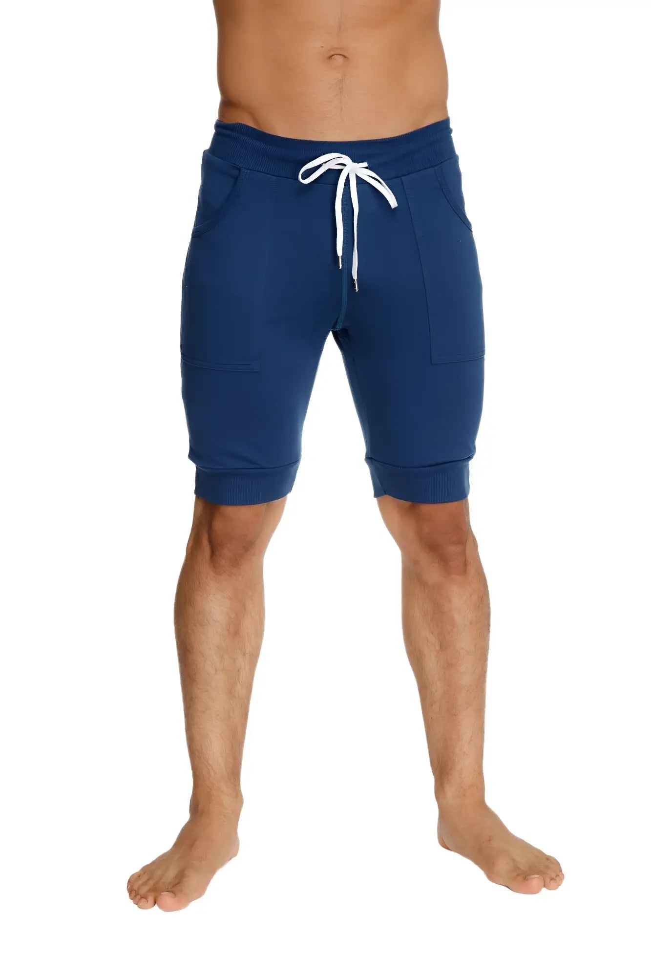 Navy blue cuffed yoga shorts with white drawstring and side pockets in jogger style for activewear