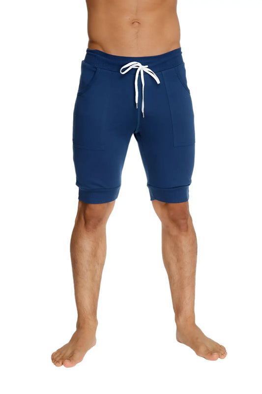 Navy blue cuffed yoga shorts with white drawstring and side pockets in jogger style for activewear