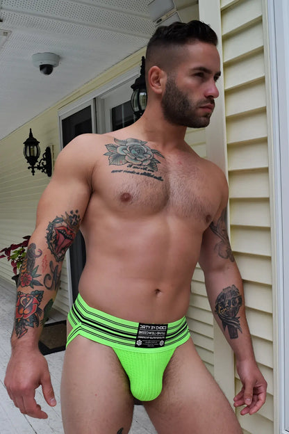Bright neon green cumdump jock athletic briefs with black horizontal stripes and branded waistband label