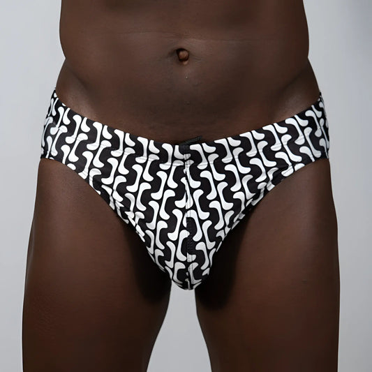 Black and white swim trunks with a bold wavy geometric print in curves print brief design