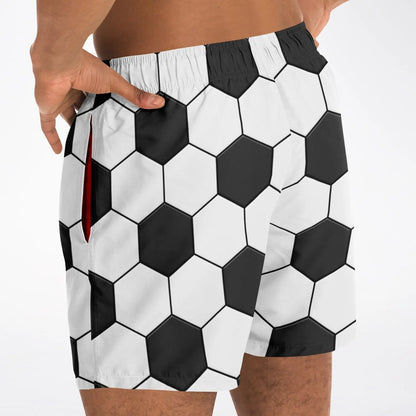 Men's swim shorts by Maris Equi featuring a black and white hexagon pattern elastic waistband and side pockets.
