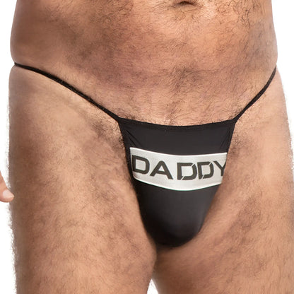 Black thong with white band featuring bold black daddy lettering front view in daddy DDK035 thong design