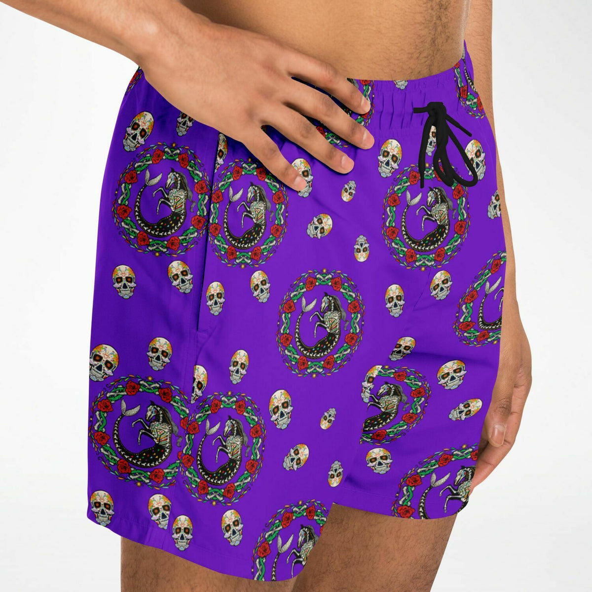 Men's swim shorts by Maris Equi in purple with Day of the Dead skull and floral pattern featuring an elastic waistband and drawstring.