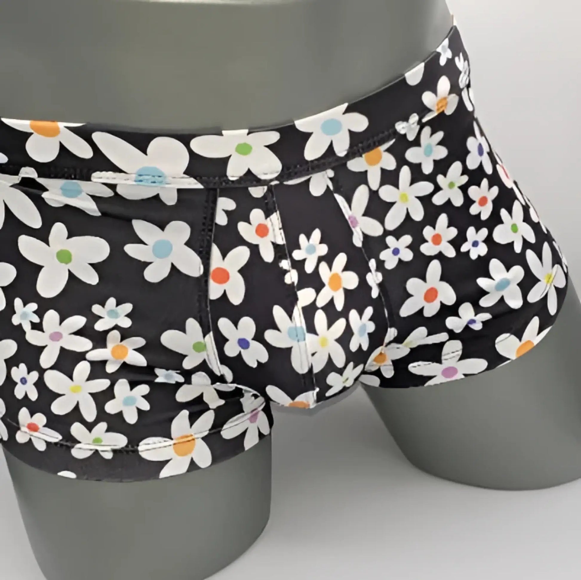 Black briefs daisy sq cut with playful white daisies and colorful orange blue purple centers pattern
