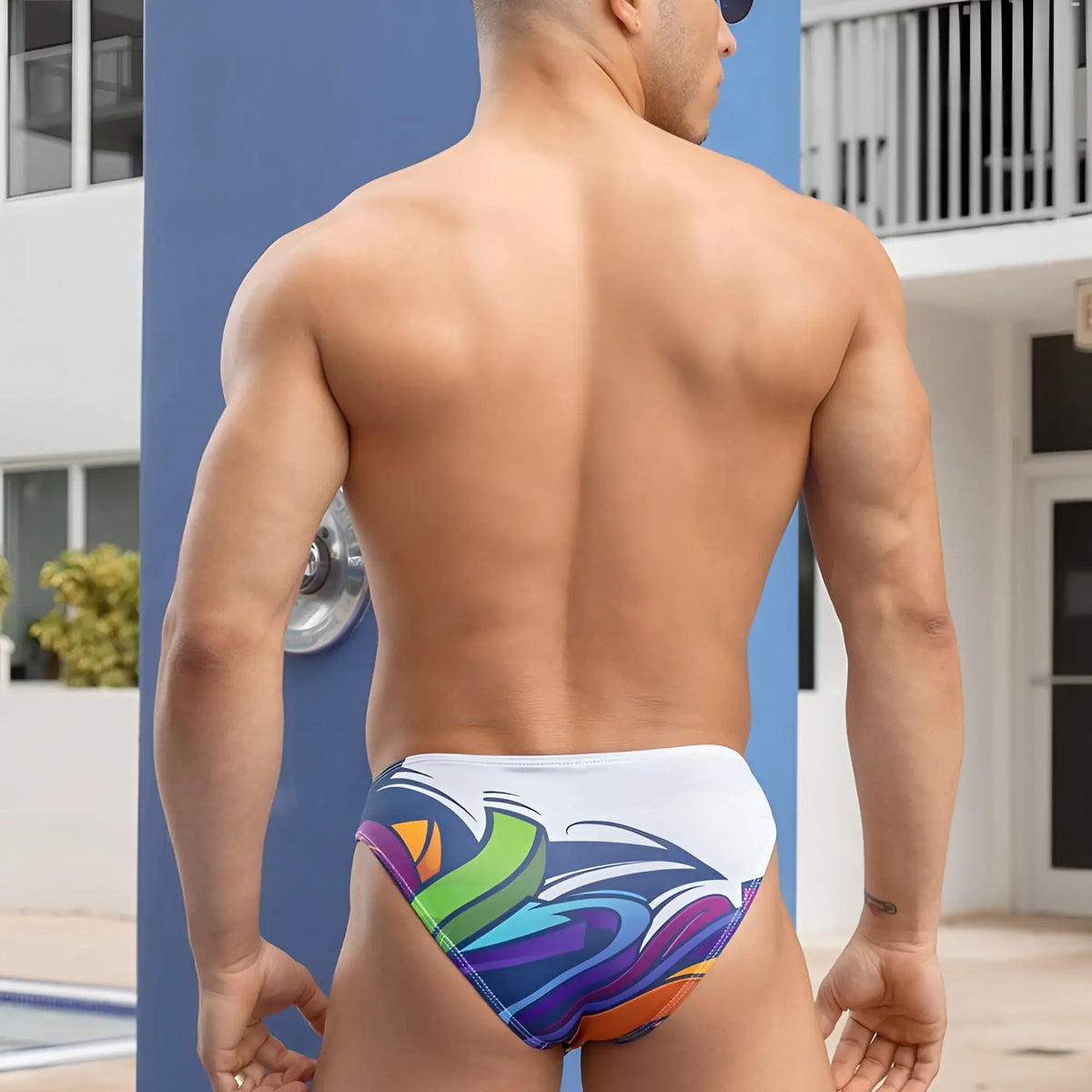 Daniel Alexander DAI065 bikini brief swim trunks in white with bold vibrant rainbow swirls for stylish beachwear