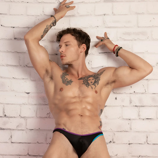 Daniel alexander dai075 bikini brief in black with purple and teal trim showing front side of briefs