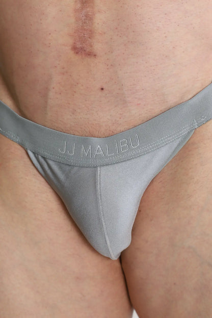 Deep back v jockstrap glacier grey with smooth stretchy fabric and narrow waistband shown from the back side
