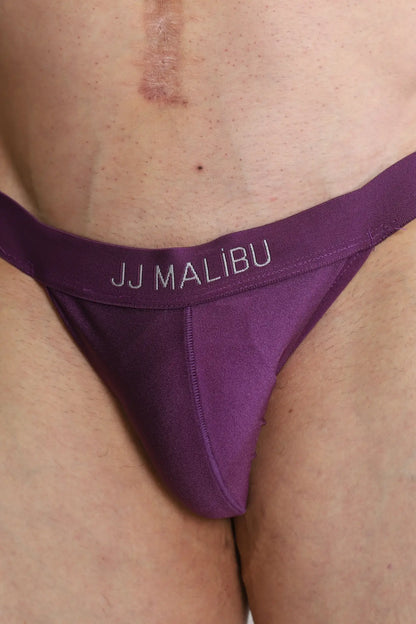 Back view of deep back v jockstrap in plum purple with smooth stretchy fabric and subtle jj malibu logo band