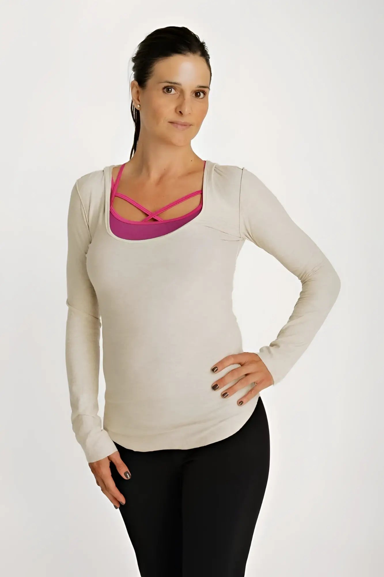 Beige long sleeve maternity hoodie top with deep scoop neck and vibrant pink crisscross neckline detail