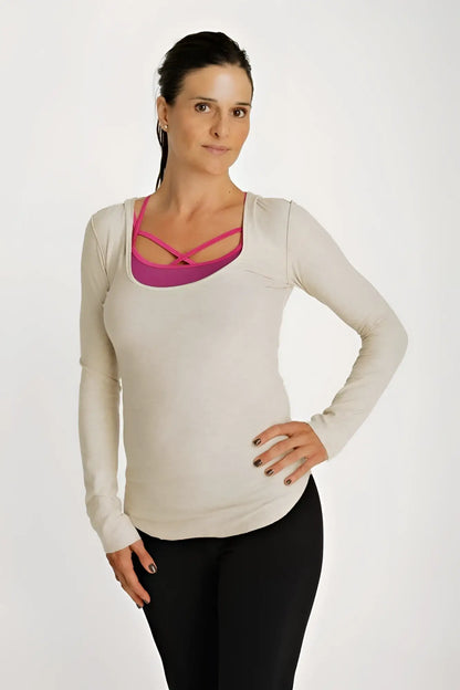 Beige long sleeve maternity hoodie top with deep scoop neck and vibrant pink crisscross neckline detail