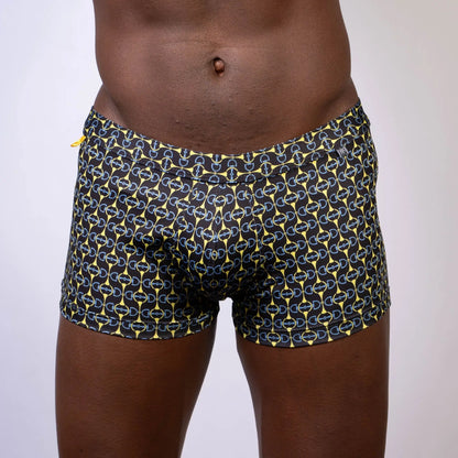 Black designer buckle print sq cut trunk swim trunks with bold yellow and light blue chain-link pattern