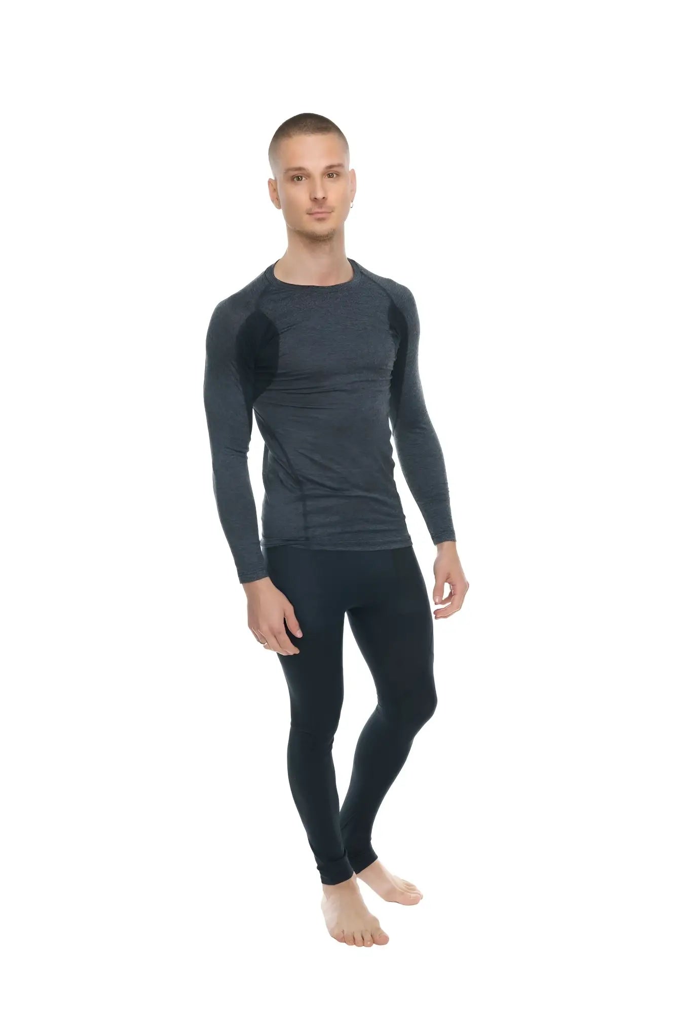 Black long-sleeved compression shirt with subtle textured panels on shoulders and torso in charcoal with black accent