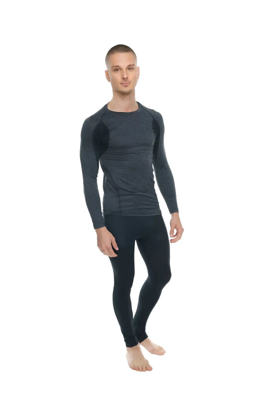 Black long-sleeved compression shirt with subtle textured panels on shoulders and torso in charcoal with black accent