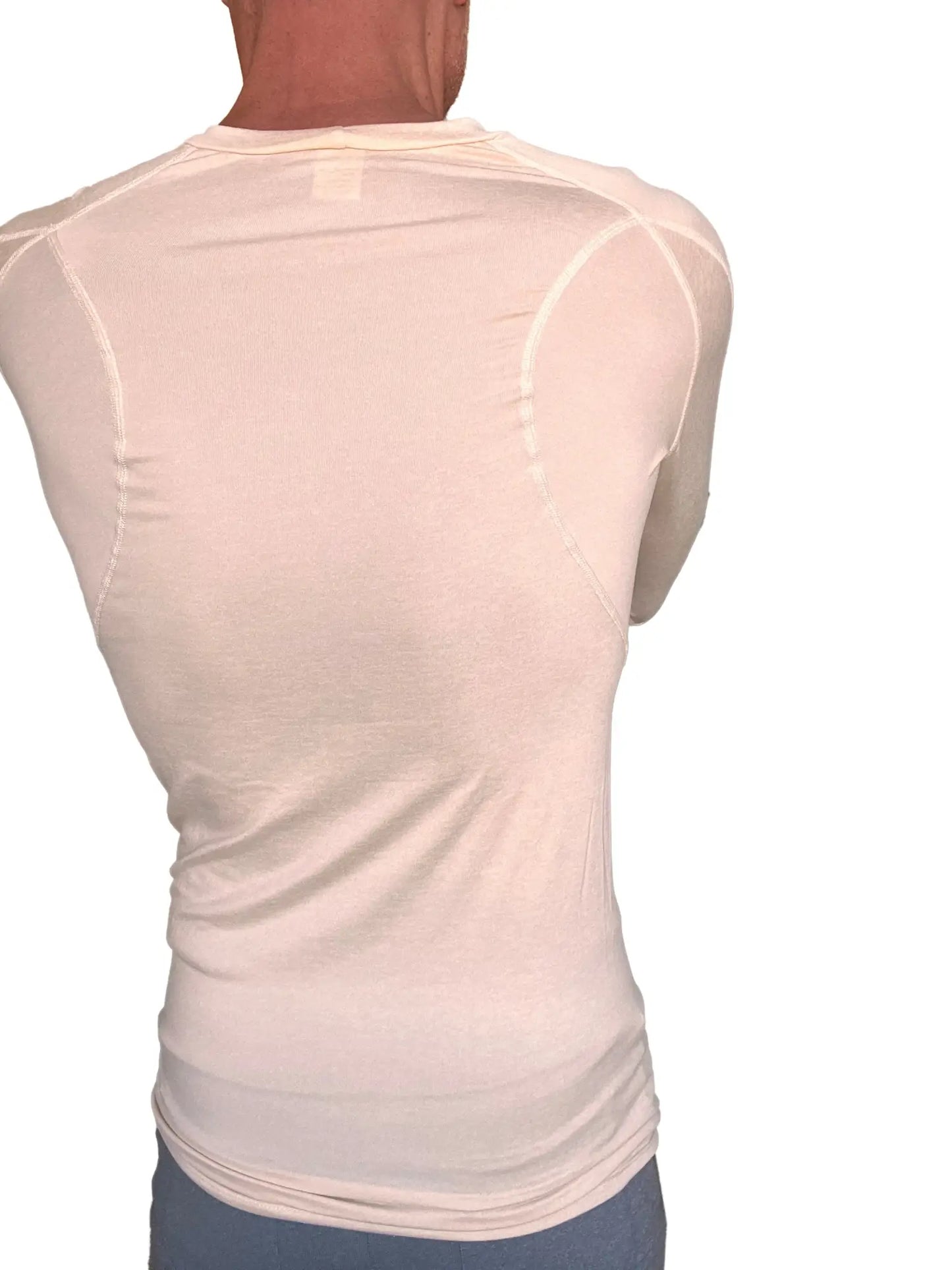 A cream-colored designer raglan crew-neck long sleeve tee with fitted design and subtle seam detailing in sand beige
