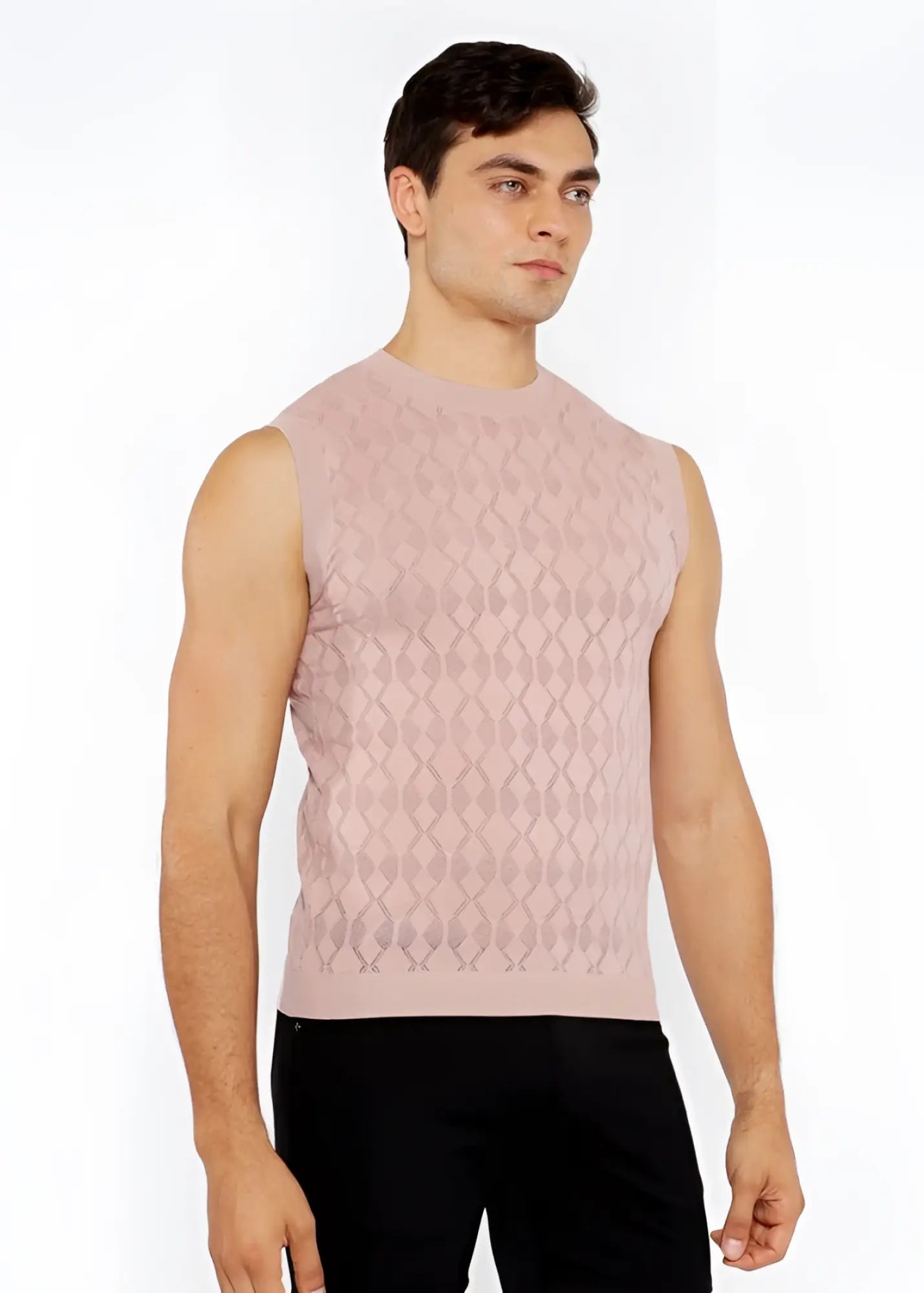 A soft pink sleeveless diamond pointelle knit vest with subtle diamond-patterned texture made of knit fabric