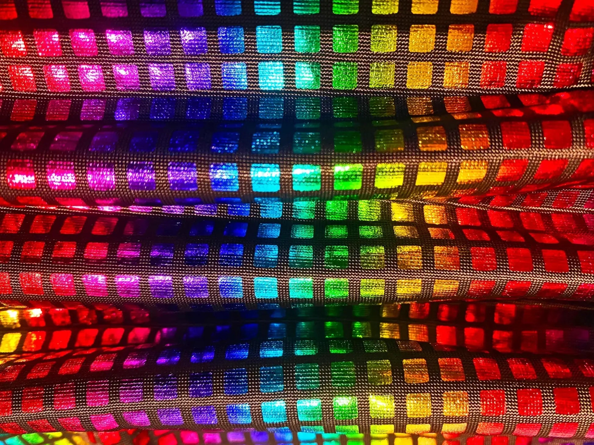 Disco queen tank featuring rainbow-colored holographic fabric with shimmering reflective squares for a bold look