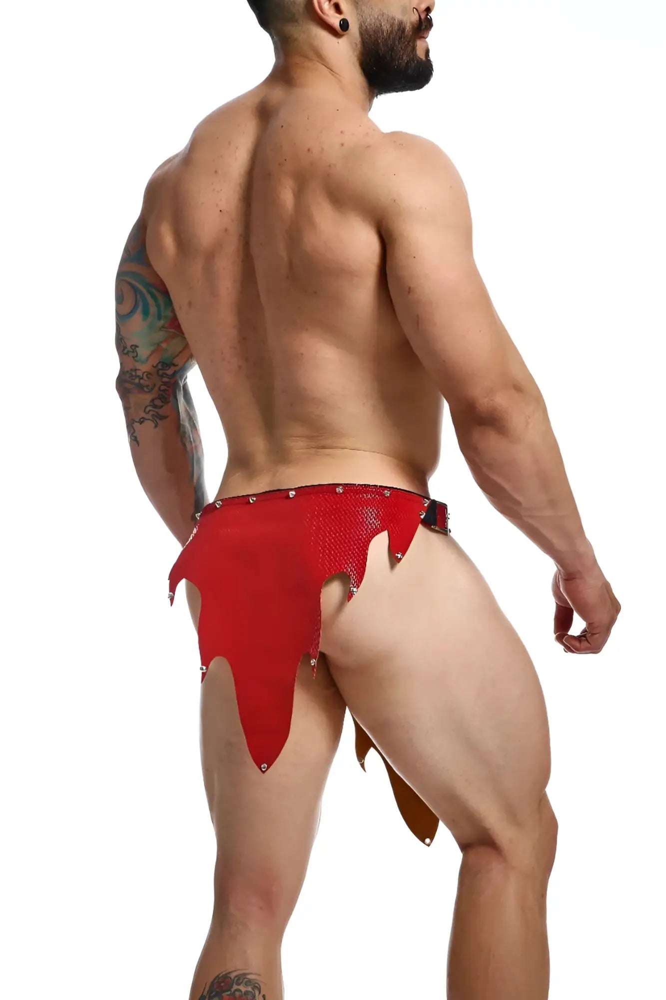 Red leather tribal-style briefs with studded detailing featured in the dungeon fire skirt collection