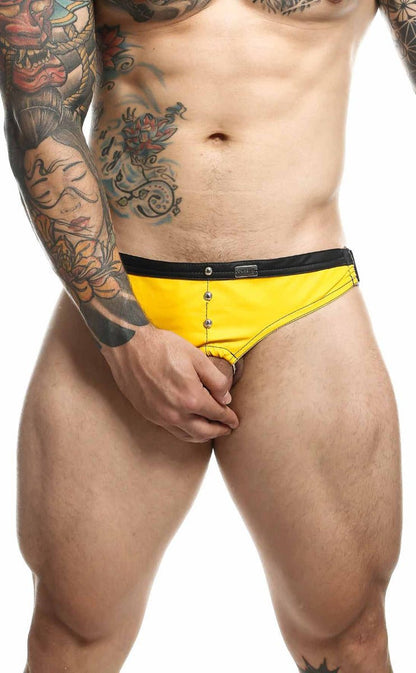 Bright yellow swim trunks with black waistband and silver button closures for dngeon c-ring jockstrap use
