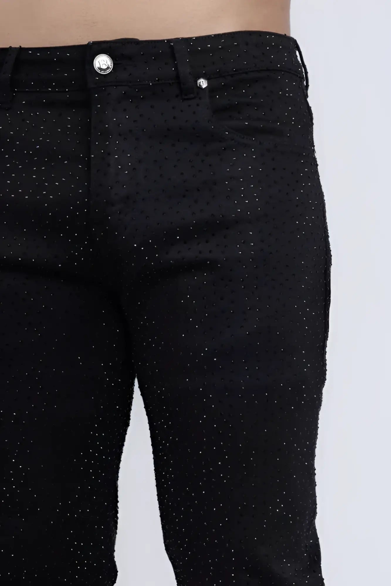 Black denim dolorosa rhinestone jeans with subtle glittery dot pattern and silver toned button front view