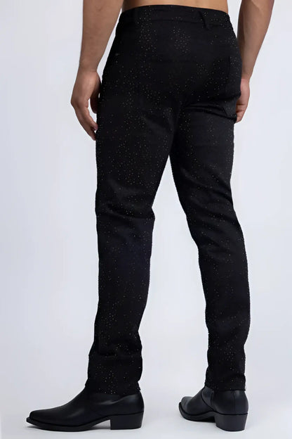 Dolorosa rhinestone jeans are black denim with a subtle glittery speckle pattern for a sparkling casual look